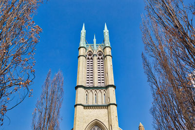 Low angle view of building against blue sky