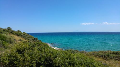 Scenic view of sea against clear blue sky