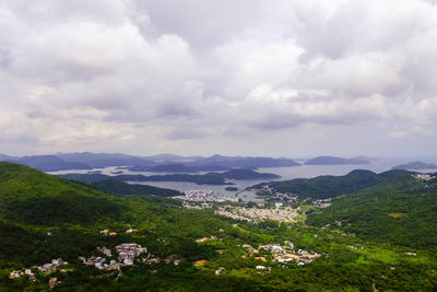 Scenic view of mountains against cloudy sky