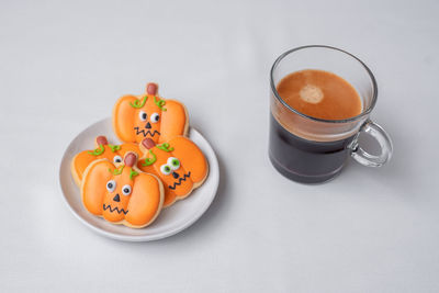 High angle view of coffee on table against white background