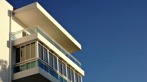 Low angle view of building against clear blue sky