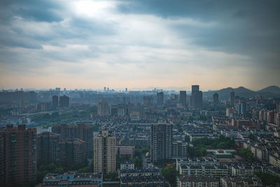 Cityscape against sky during sunset