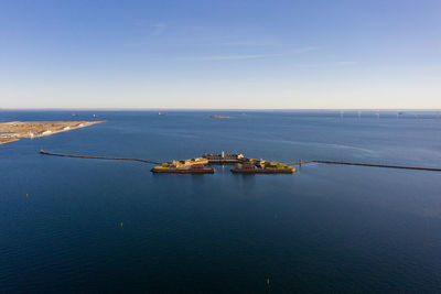 Scenic view of sea against blue sky