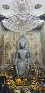 Statue of buddha outside building