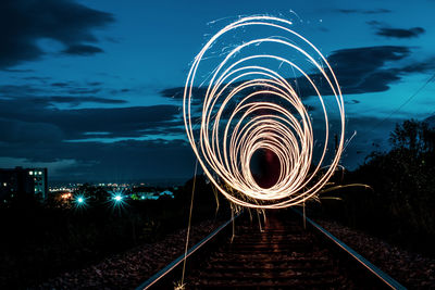 Light trails against sky at night