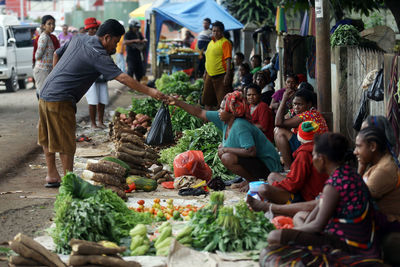 People at market stall