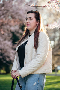 Portrait of young woman standing outdoors