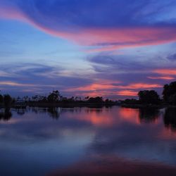 Scenic view of calm lake at sunset