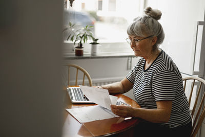 Senior woman using laptop