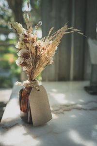 Close-up of wilted plant on table