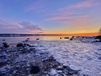 Scenic view of sea against sky during sunset