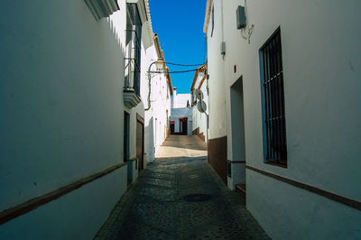 Narrow alley amidst buildings in city