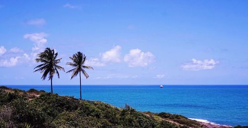 Scenic view of sea against cloudy sky