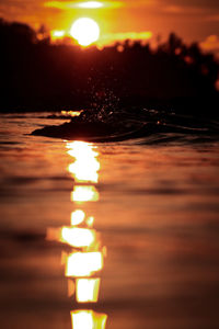 Close-up of illuminated lights at sunset