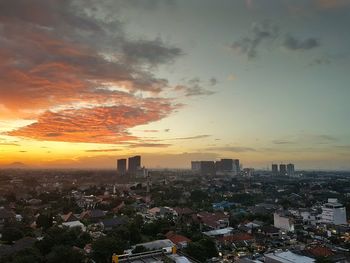 High angle view of city at sunset