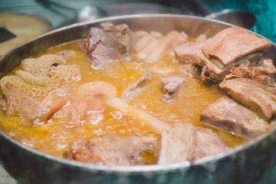 Close-up of meat in cooking pan