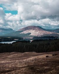 Scenic view of landscape and mountains against sky