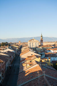 High angle view of buildings in city against clear sky