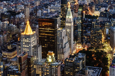 Aerial view of city lit up at night