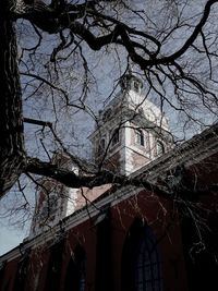 Low angle view of bare trees against the sky