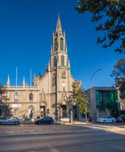 Low angle view of historic building against clear blue sky