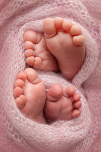 Close-up of baby on bed