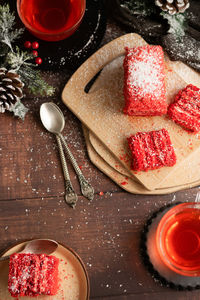 Strawberry piece of cake and red fruit tea, with winter decorations