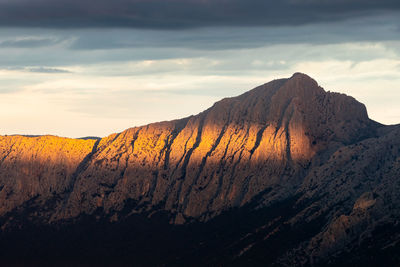 Scenic view of mountains against sky during sunset