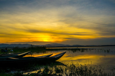 Scenic view of lake against sky during sunset