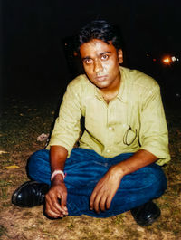 Portrait of man sitting outdoors