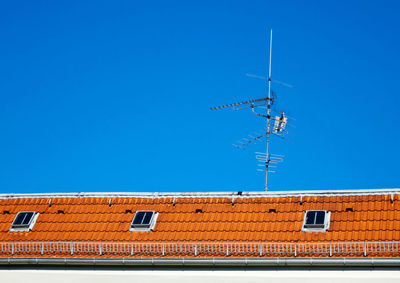 Low angle view of building against clear blue sky