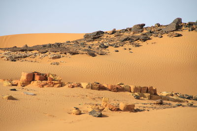 Scenic view of desert against clear sky