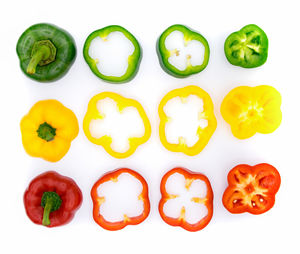 Directly above shot of bell peppers on white background