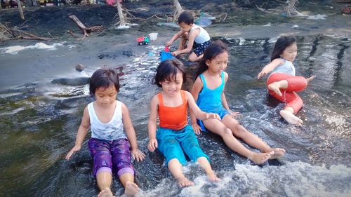 High angle view of people enjoying in water