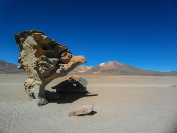 View of desert against blue sky