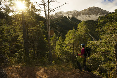 Side view of man walking on hill