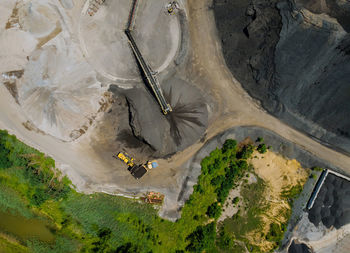 High angle view of kites flying over landscape