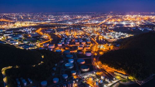Aerial view of petrochemical plant in city at night
