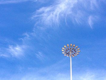 Low angle view of lamp post against blue sky