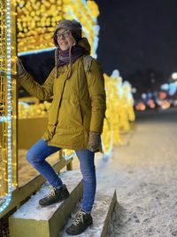 Full length portrait of woman on snow