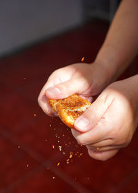 Close-up of hand holding ice cream