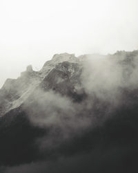 Scenic view of mountains in foggy weather