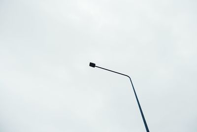 Low angle view of street light against sky