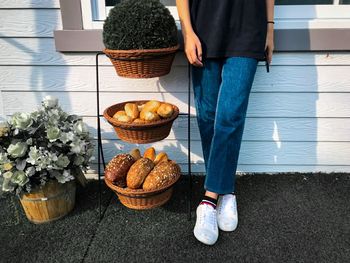 Low section of woman standing on table