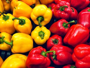 Full frame shot of red and yellow sweet bell pepper for sale at market stall