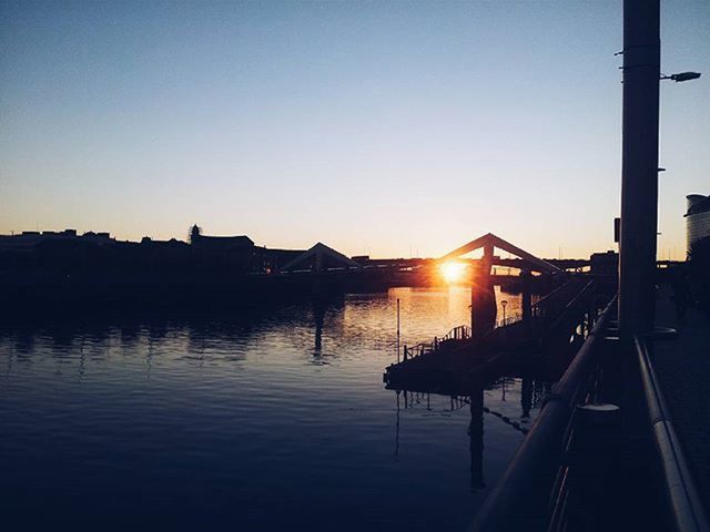 clear sky, built structure, architecture, water, building exterior, copy space, sunset, silhouette, river, reflection, dusk, nautical vessel, lake, tranquility, house, transportation, sky, no people, nature, outdoors