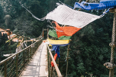View of footbridge hanging on mountain