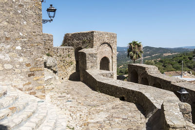 Low angle view of old ruins against clear sky