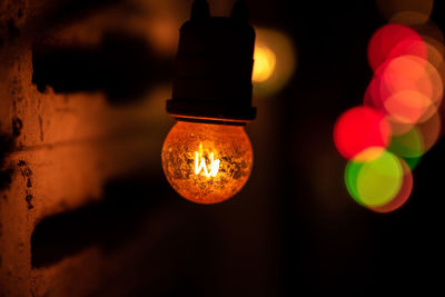 Close-up of illuminated light bulb