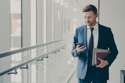 Portrait of businessman standing in office